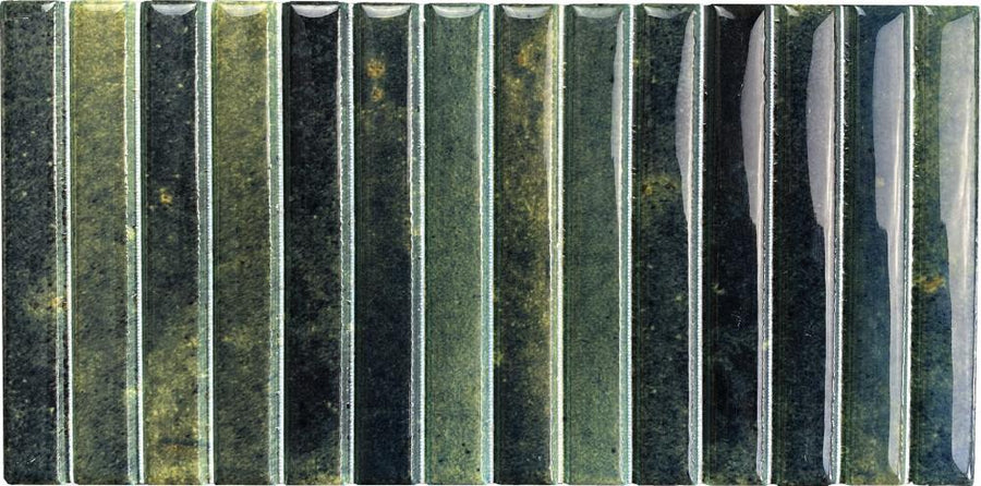 Parallel 4.5 x 9.1 Glazed Porcelain Tile features a rectangular shape with a fluted design, vertical ridges in green accented by yellow and black tones, and a glossy finish that reflects light on the right side.