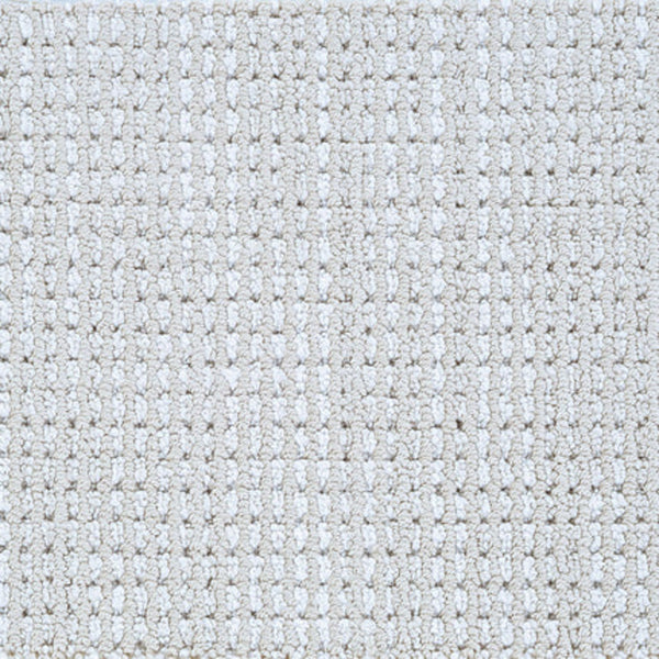 Close-up of Top Notch Berber Carpet in Parchment color, showing a soft surface with evenly spaced loops in a subtle, raised checkerboard pattern—a stylish and premium flooring option.