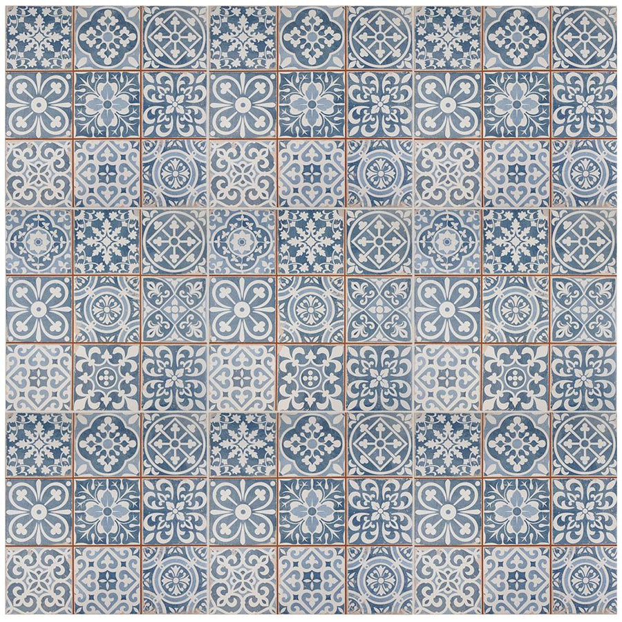 A grid of square, blue and white ceramic tiles with various intricate floral and geometric patterns, arranged in a repeating mosaic design.