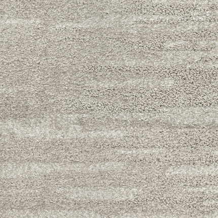 Close-up of Cirrus Berber Carpet in Pearl color, featuring a soft, plush surface with subtle color variations. This cozy and comfortable material is perfect for premium indoor flooring.