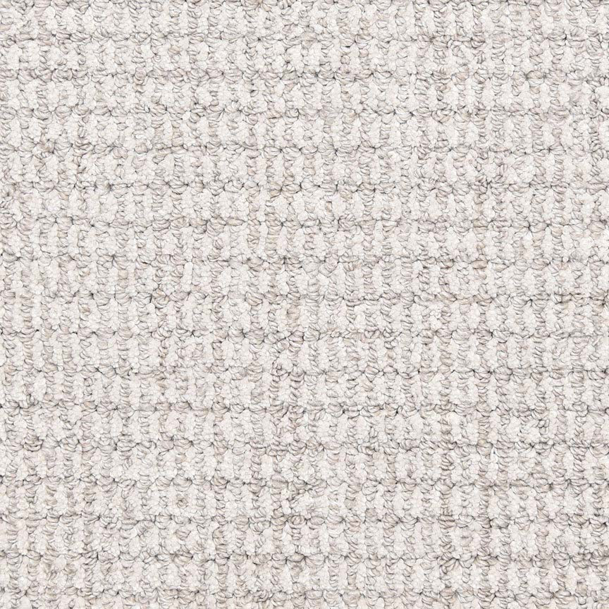 Close-up of Aspen Berber Carpet in Pewter, featuring a textured, looped woven pattern with tightly packed, small rounded loops arranged uniformly for a consistent look.