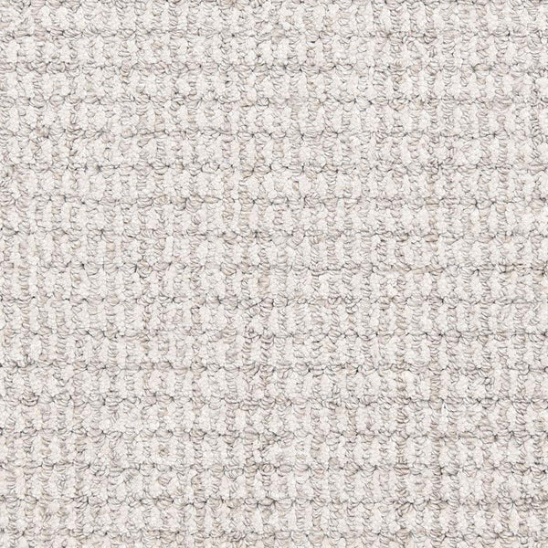 Close-up of Aspen Berber Carpet in Pewter, featuring a textured, looped woven pattern with tightly packed, small rounded loops arranged uniformly for a consistent look.