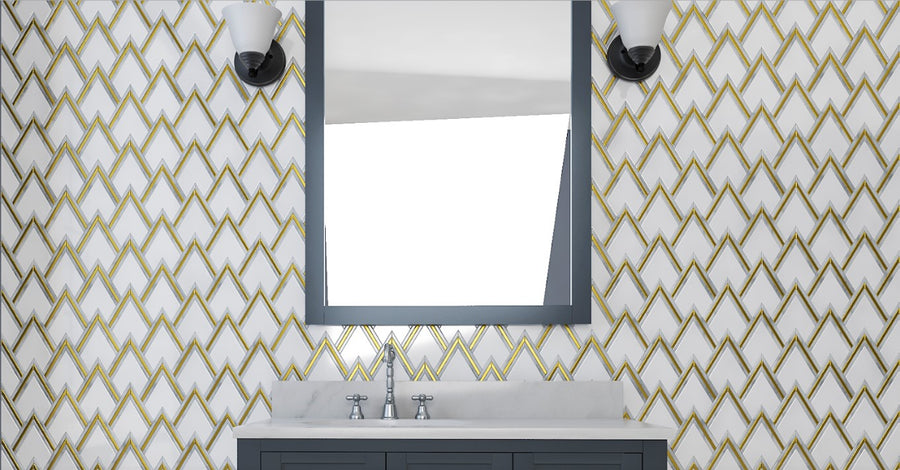 A bathroom with patterned wallpaper, a large rectangular mirror, two wall-mounted lights, a marble countertop, and a dark-colored vanity with a sink and silver faucet.