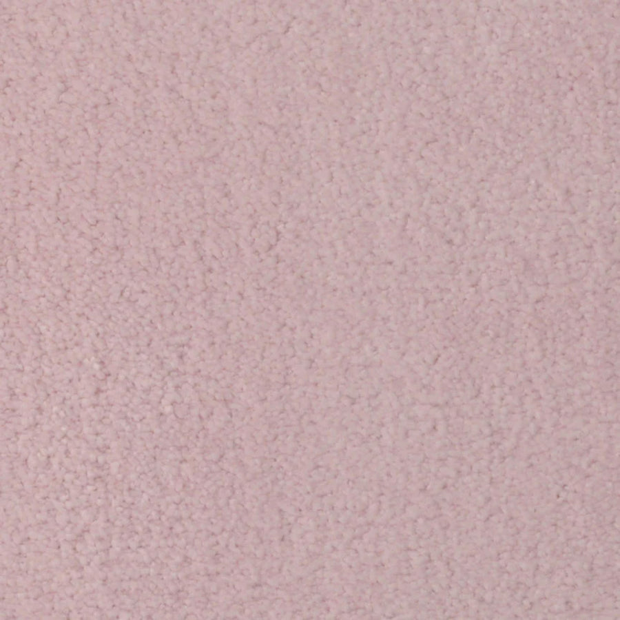 Close-up of Seduction On Trend Carpet in Pink Nectar, featuring a soft, plush surface with densely packed fibers for a cozy, elegant look. The light pink shade and subtle texture highlight its durability and luxury. No objects or patterns are visible.