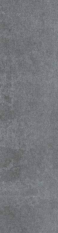 Close-up view of a textured, gray stone or concrete surface with subtle variations in shading and a slightly rough appearance.