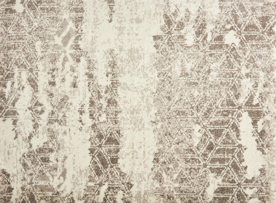 The Delphi On Trend Carpet in Platinum features a faded abstract geometric pattern with interlocking hexagons and a distressed texture—an elegant, modern flooring choice for any space.