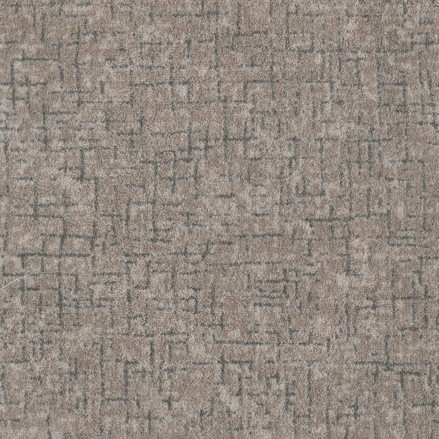 Close-up of Pleasant Path On Trend Carpet in Storm color, featuring a textured, durable surface with a light brown base and subtle dark gray geometric pattern—perfect for a contemporary look.
