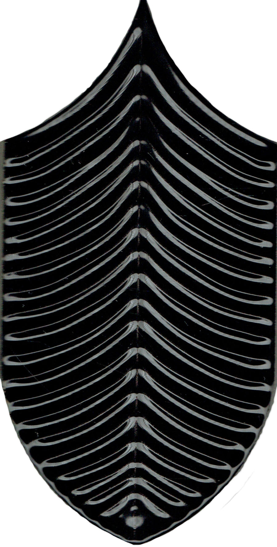 The Plume 4x8 Ceramic Tile features a symmetrical black-and-white abstract, leaf-shaped shield design with curved, rib-like lines—ideal for a modern ceramic tile installation or a bold tropical accent.