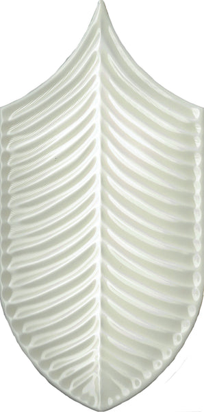 The Plume 4x8 Ceramic Tile is a white, shield-shaped tropical tile with a glossy finish and a textured, symmetrical pattern that resembles leaf veins or fish bones.