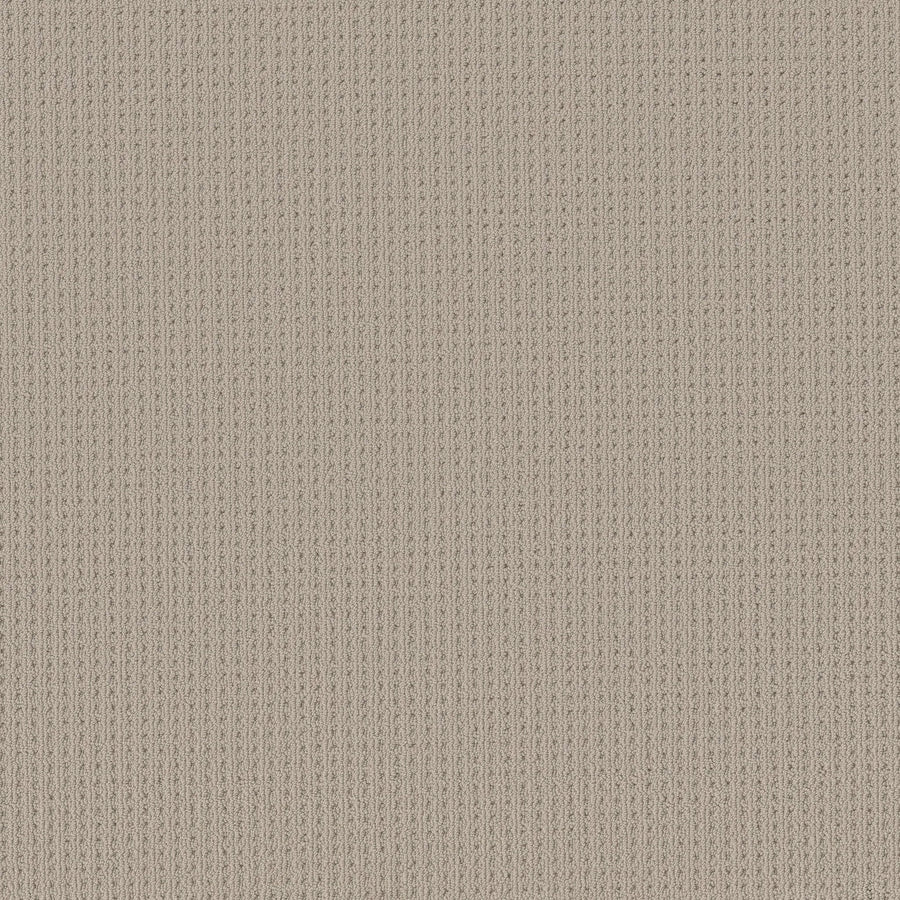 Close-up of San Lucas Family Friendly Carpet in Plymouth color, featuring a beige vertical ribbed knit texture with fine, evenly spaced lines—perfect for high-traffic, family-friendly homes.