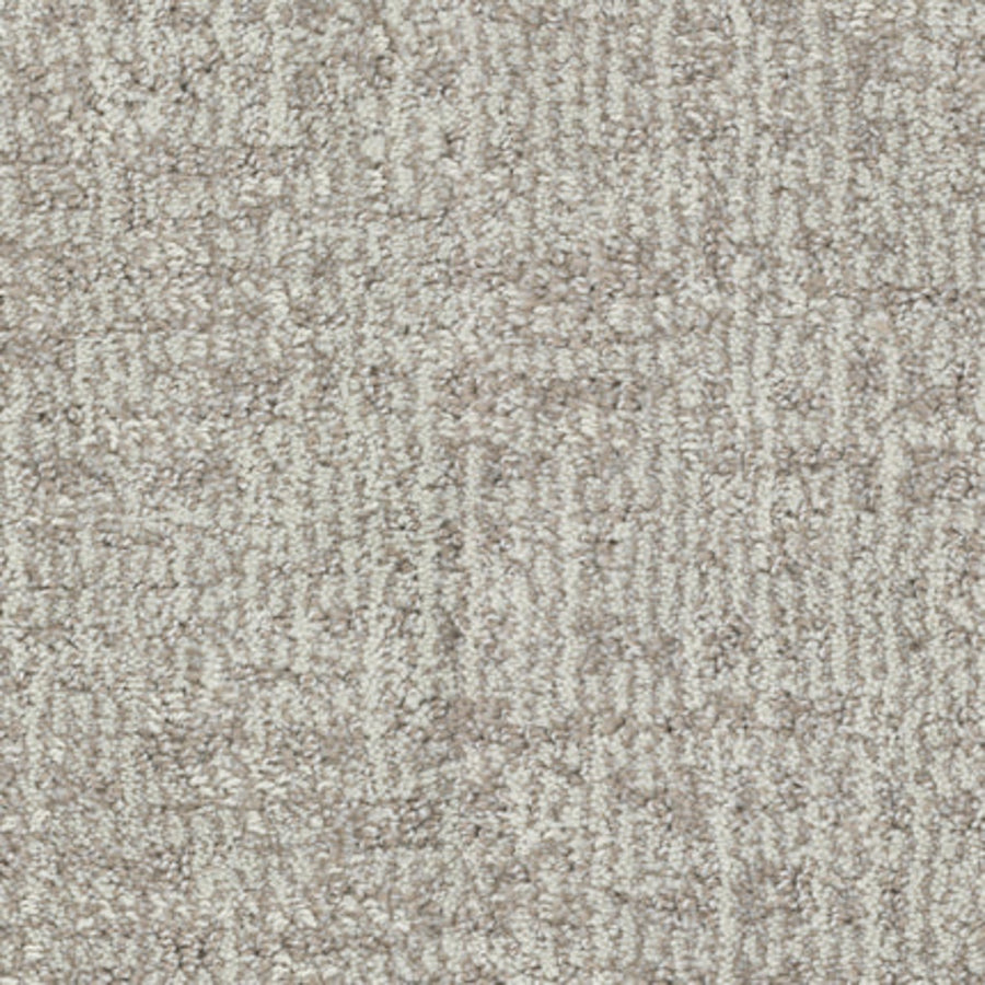 Close-up of Balance Family Friendly Carpet in Poise—a light grey, textured carpet with a subtle, irregular geometric pattern. Features soft, plush surface with mixed fiber lengths for comfort and durability.