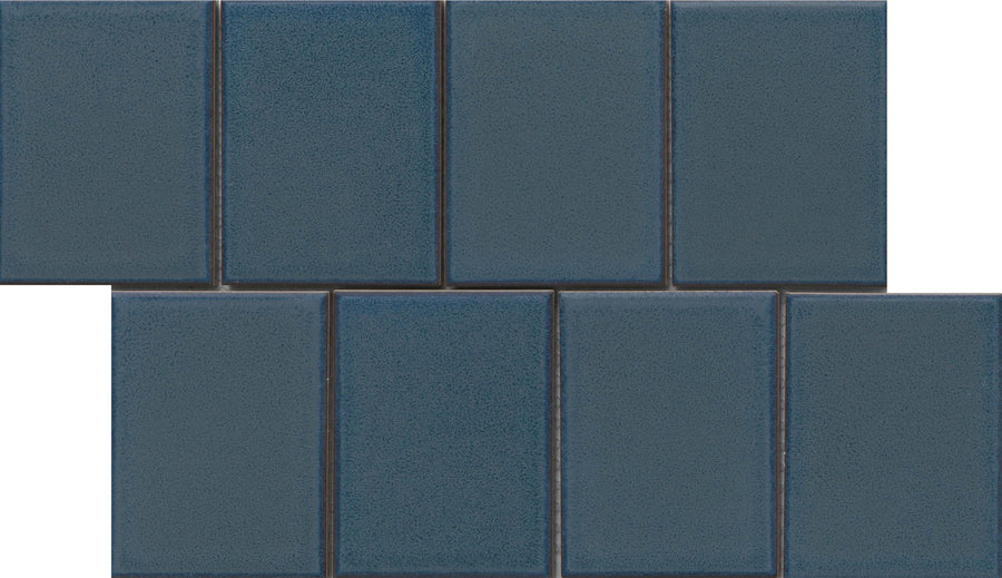 The Marco and Polo 4x5 Glossy Porcelain Tile in Polo Blue features a rectangular shape and a glossy finish, ideal for creating a stylish staggered pattern with designer appeal.
