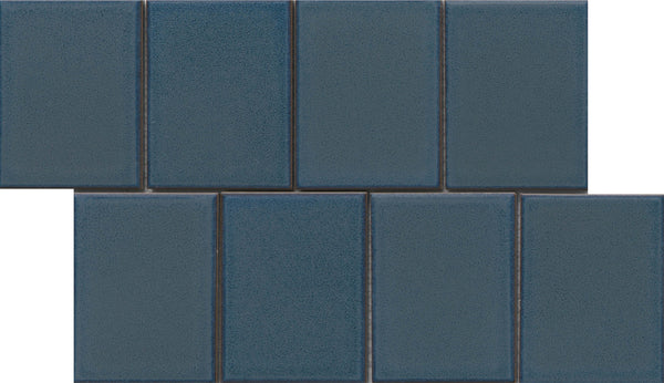 The Marco and Polo 4x5 Glossy Porcelain Tile in Polo Blue features a rectangular shape and a glossy finish, ideal for creating a stylish staggered pattern with designer appeal.