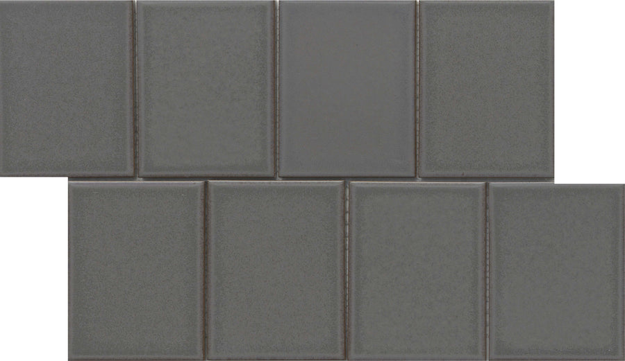 Eight glossy Marco and Polo 4x5 Porcelain Tiles in Polo Coal are arranged in two staggered rows on a white background. Each frameless tile shows subtle borders and varied shading, giving a textured, modern designer look.