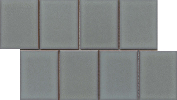 Marco and Polo 4x5 Glossy Porcelain Tiles in Polo Gray are arranged in a brick pattern with each row slightly offset. Their glossy, frameless design offers a sleek, modern look perfect for contemporary spaces.