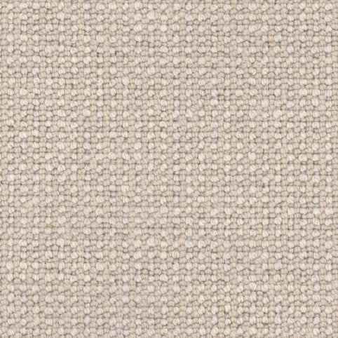 Close-up of Andros Berber Carpet in Poplar, featuring a tightly woven, grid-like texture. The soft, uniform surface highlights small, evenly spaced threads for a refined, premium finish.