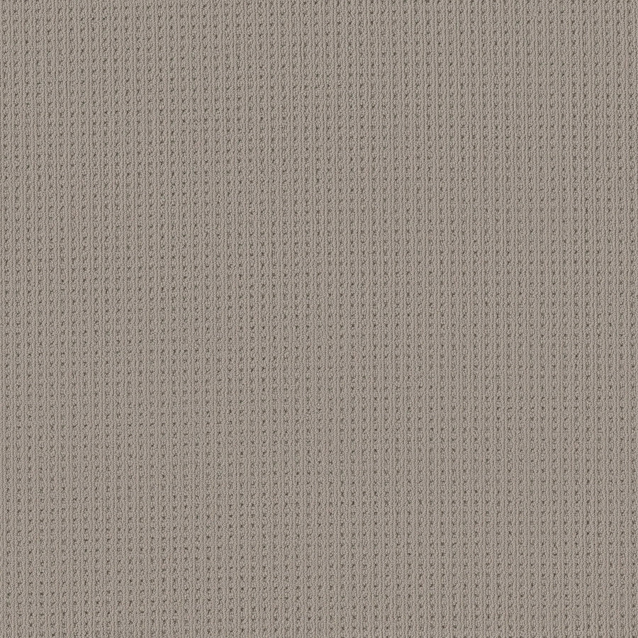 A close-up of San Lucas Family Friendly Carpet in Portico color highlights its beige ribbed fabric with vertical textured lines, featuring a detailed knit pattern—soft and uniform, ideal for high-traffic or family spaces.