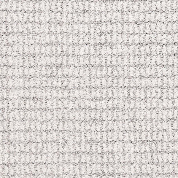 A close-up of Aspen Berber Carpet in Powder color, featuring a soft, textured grid pattern with looped fibers that create a raised, structured surface.