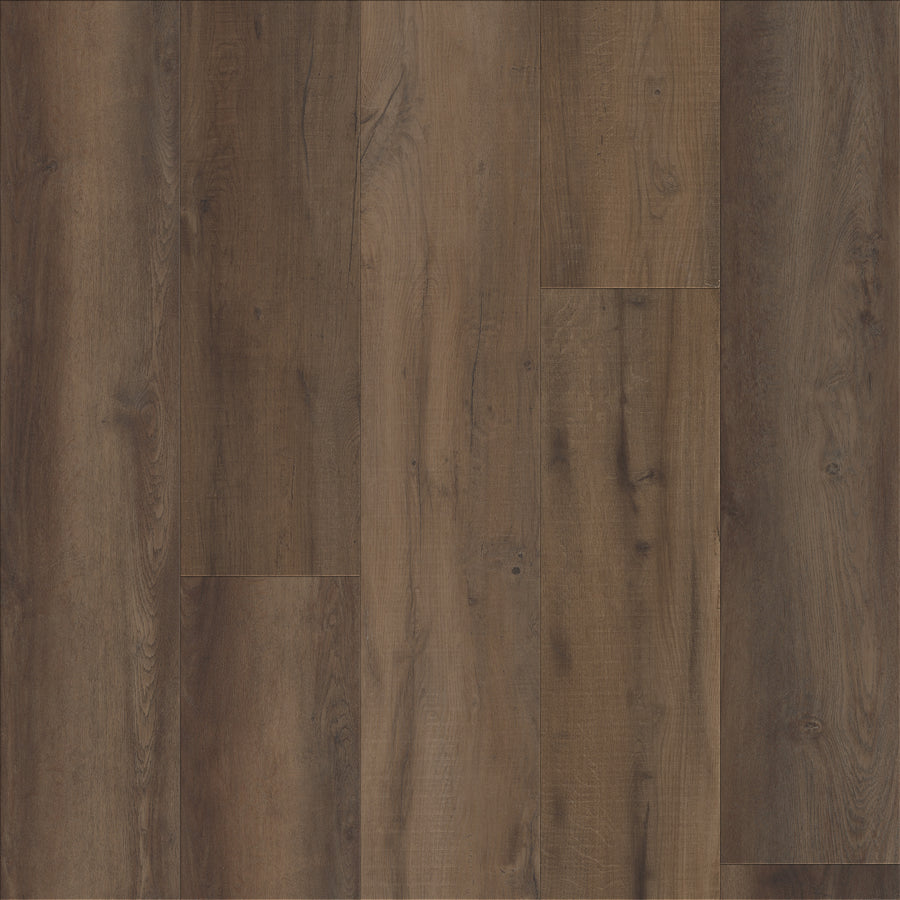 Coretec Plus Premium Vinyl features dark brown planks with natural grain patterns, subtle texture, and rustic wood-look. Installed in a staggered pattern, it displays warm color variations and visible knots for an authentic appearance.