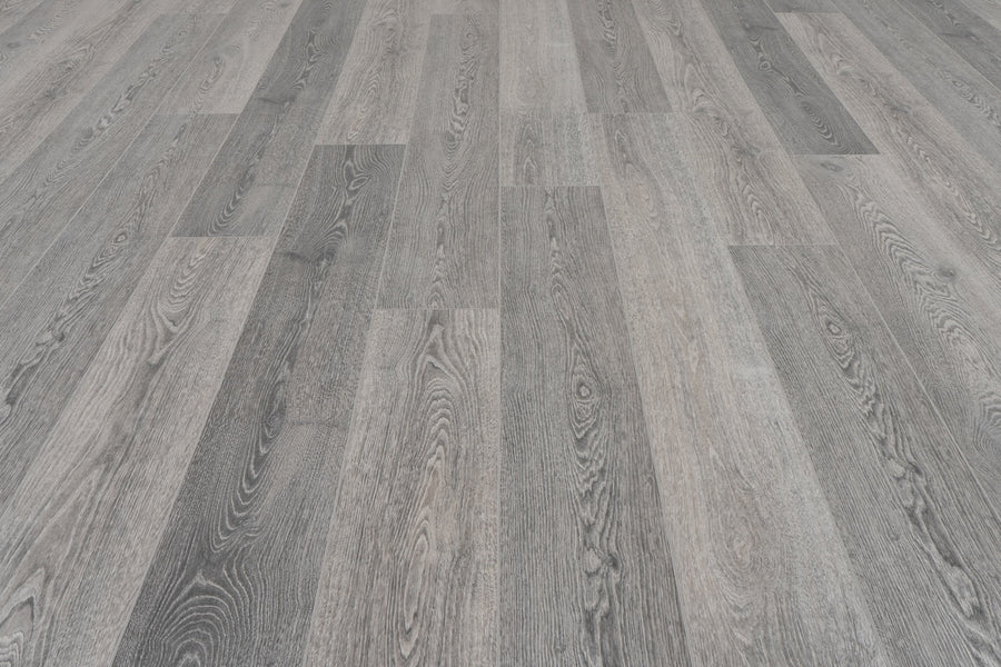 Concorde 7.2" Luxury Vinyl Plank features gray wood-look finish with visible grain and staggered planks, offering varied gray tones for a modern, textured style—ideal for premium flooring projects.