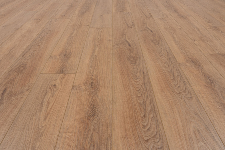 Close-up of Concorde 7.2" Luxury Vinyl Plank flooring in light brown with natural wood grain and parallel plank texture. This premium vinyl features a beautiful, clean, and well-maintained wood-look finish.