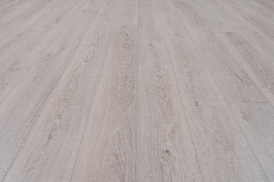 Concorde 7.2" Luxury Vinyl Plank features light wood tones with natural grain and subtle knots in long, parallel planks. Its premium wood-look finish brightens any modern space, ideal for contemporary interiors.