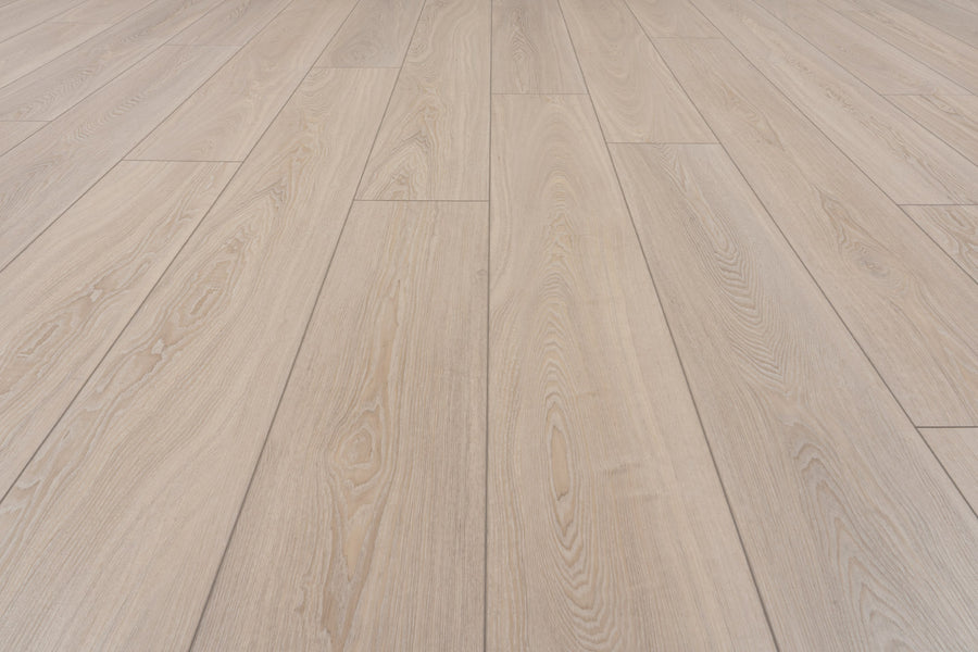 Concorde 7.2" Luxury Vinyl Plank features light wood tones, a natural grain pattern, and a smooth wood-look finish. Planks are laid lengthwise for a clean, modern style with subtle color variations and a premium appearance.