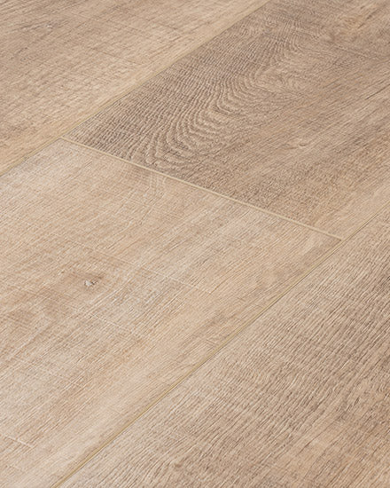 Close-up of Moda Living 7.15" Luxury Vinyl Plank, featuring light brown wood-look flooring with visible grain patterns and rectangular planks. Its natural, textured surface closely resembles real hardwood.
