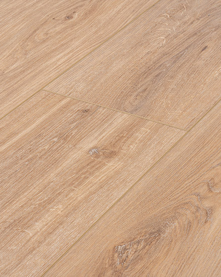 Close-up view of Moda Living 7.15" Luxury Vinyl Plank flooring in light brown, featuring a natural grain pattern with subtle knots, arranged in a staggered design for a seamless, scratch-resistant wood-look finish.