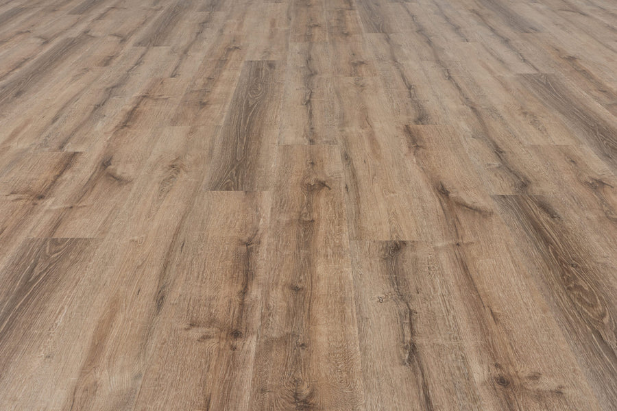 A close-up of Uptown Chic 7.15" Luxury Vinyl Plank flooring highlights natural wood grain patterns, rich brown tones, and the realistic texture and alignment of the planks.