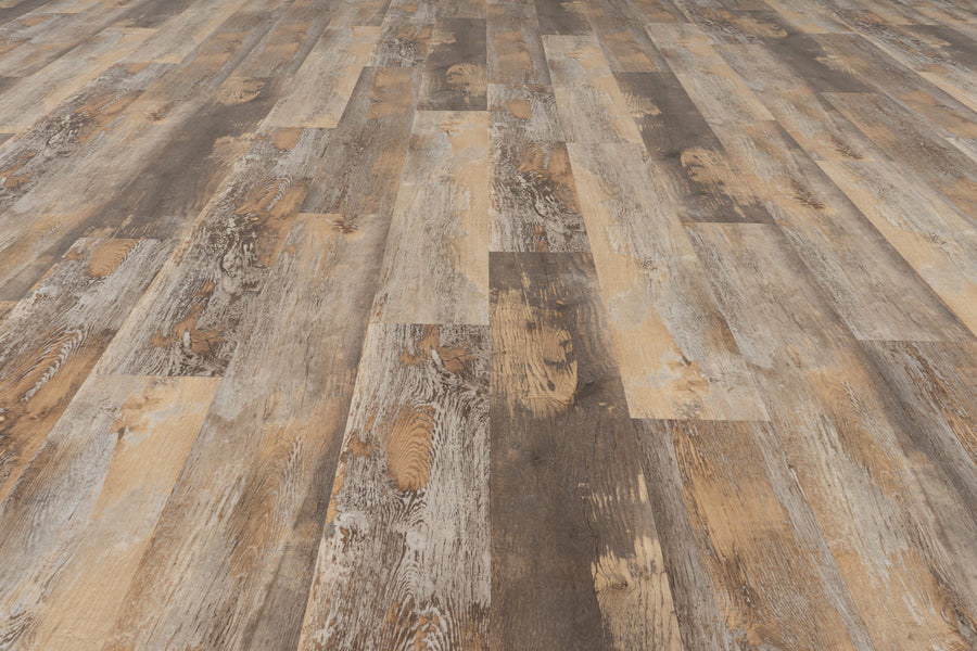 A close-up of Uptown Chic 7.15" Luxury Vinyl Plank flooring displays wide planks in brown and beige tones, highlighting a textured, rustic, and weathered wood look.