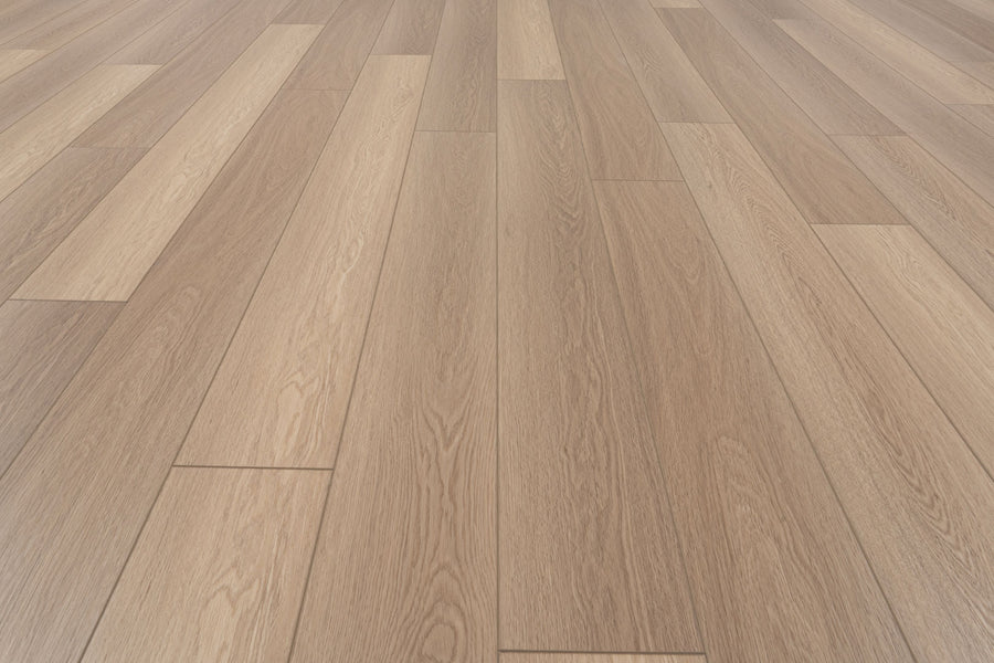 Uptown Chic 7.15" Luxury Vinyl Plank flooring in light brown, featuring a staggered arrangement with natural wood grain and texture. The clean, smooth surface extends uniformly to the edges.