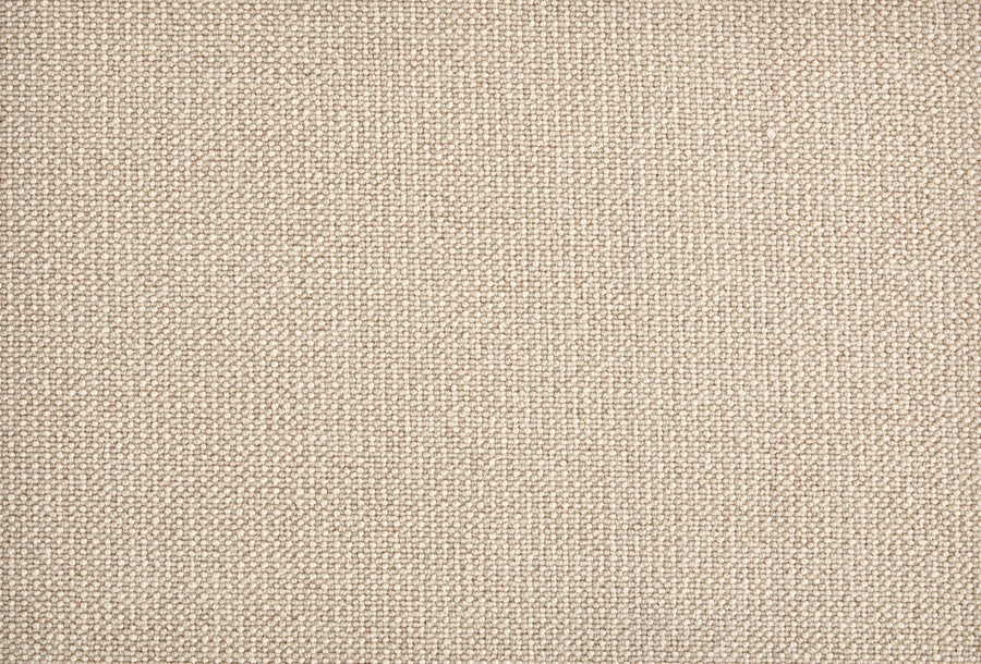 Close-up of Harper Berber Carpet in Putty, featuring a beige woven texture with small, tightly interlaced threads for everyday durability and a consistent, natural look.