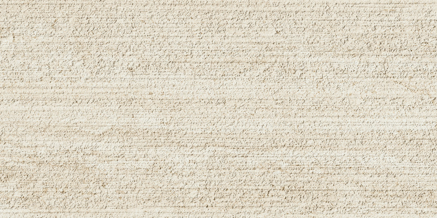 The Villanova 12x24 3D Relief Rectified Porcelain Tile features a light beige, textured surface with subtle horizontal and vertical lines, resembling weathered parchment for a tactile, natural look.