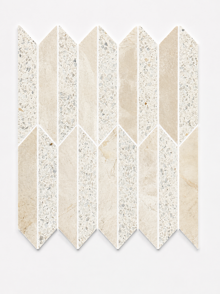 Revive Terrazzo & Korbell Half Picket Mosaic in Amplify features a chevron-patterned arrangement of tiles in beige and off-white hues, combining alternating solid and speckled textures inspired by Korbell marble and classic Terrazzo mosaic. The geometric, repetitive pattern is set against a plain white background.