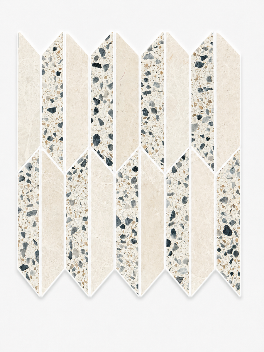 A herringbone-style geometric tile pattern featuring the Revive Terrazzo & Korbell Half Picket Mosaic in Pave, with alternating cream Korbell marble and terrazzo mosaic pieces set against a white background.