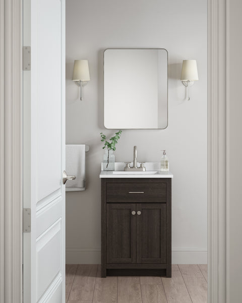 A small, modern bathroom features the Reese 24