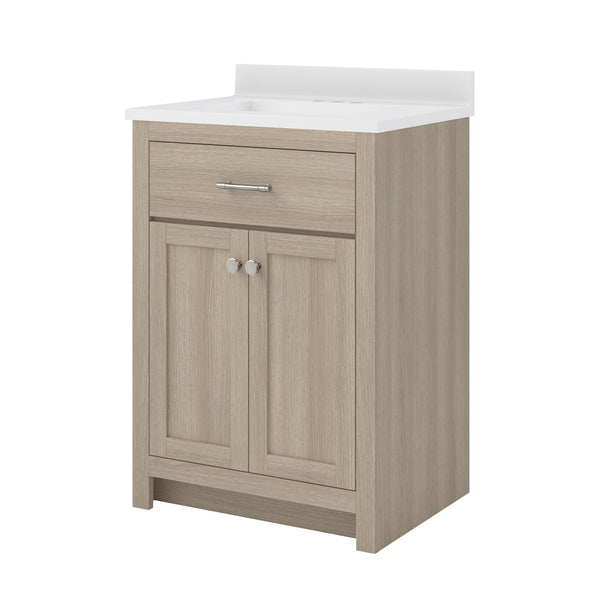 Light wood bathroom vanity with a white countertop, a single drawer with a silver handle, and two cabinet doors with round silver knobs, set against a plain white background.