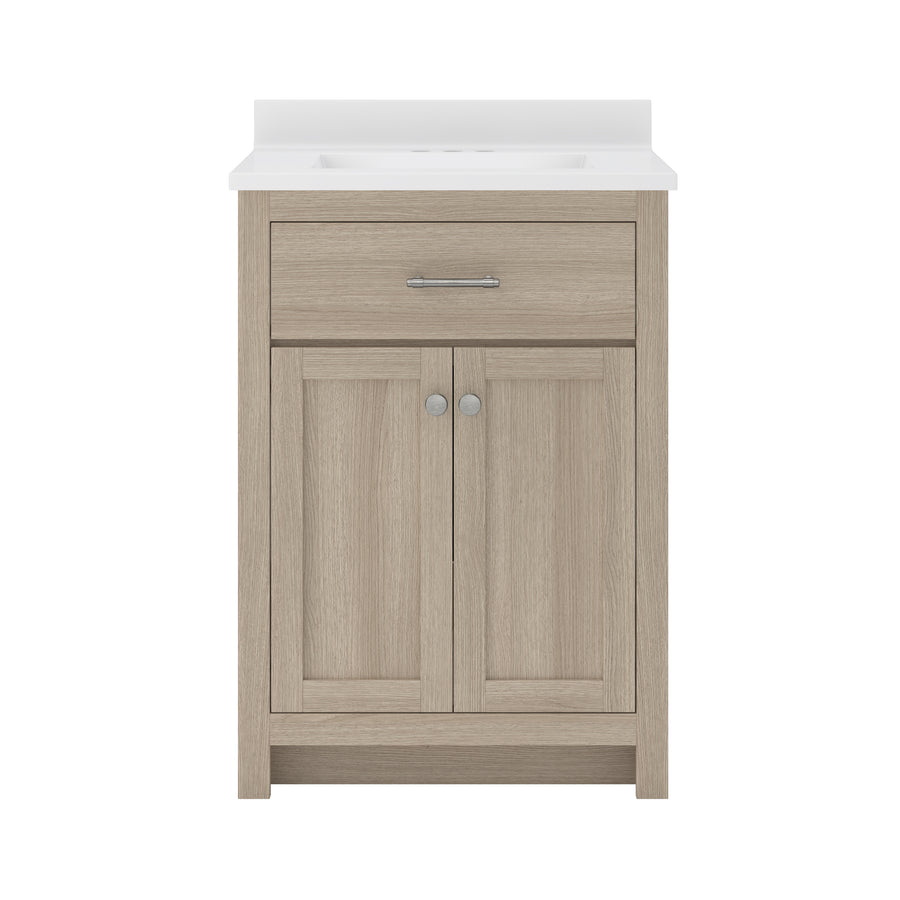 A light wood bathroom vanity with a white countertop, a single drawer with a horizontal handle, and two cabinet doors with round knobs, all set against a white background.