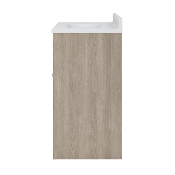 Side view of a modern bathroom vanity with a light wood finish cabinet and a white countertop with an integrated sink.