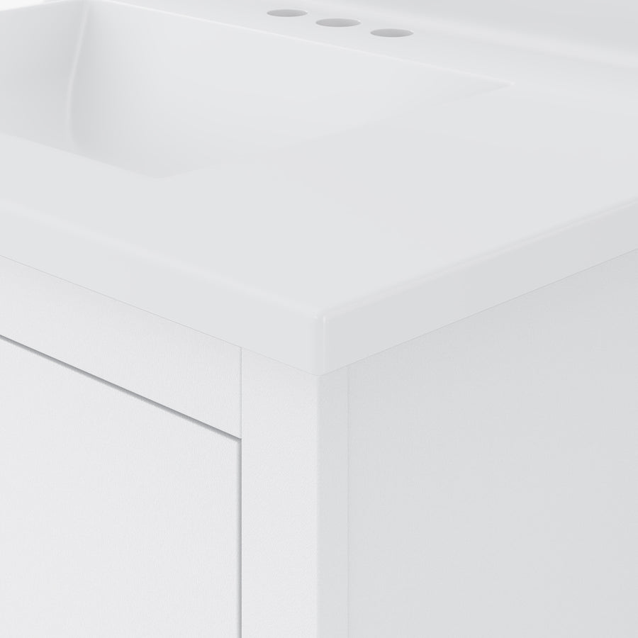 Close-up of a modern white bathroom vanity with a flat countertop, integrated sink, and three faucet holes. The design is minimalist, with clean lines and a smooth surface.