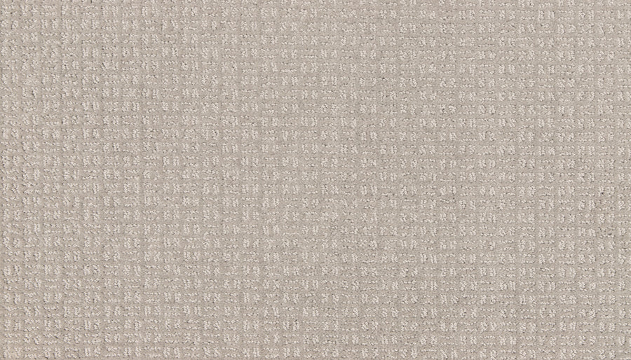 Close-up of the Radiant Space On Trend Carpet in Destiny, showcasing its soft, textured beige surface with a subtle checkerboard pattern, evoking the plush feel and modern style of contemporary carpeting.