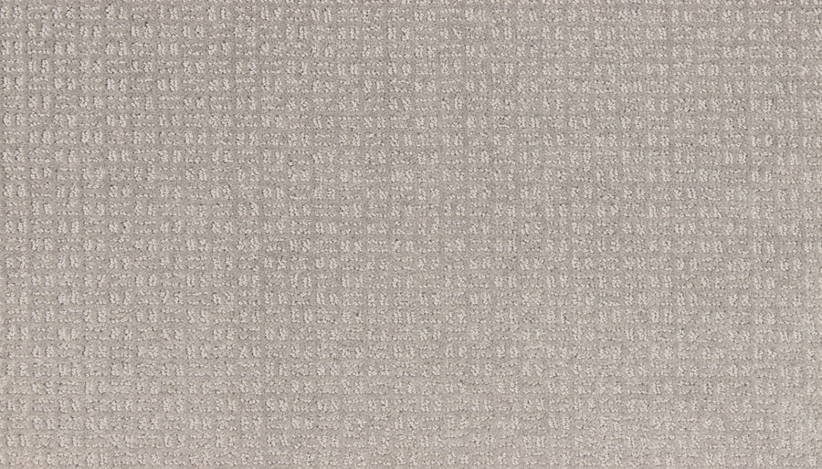 Close-up of Radiant Space On Trend Carpet in Morning Dew, featuring a light beige textured surface with a subtle grid pattern. The cushioned, slightly raised feel adds cozy comfort—ideal for modern contemporary spaces.