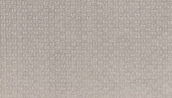 Close-up of Radiant Space On Trend Carpet in Morning Dew, featuring a light beige textured surface with a subtle grid pattern. The cushioned, slightly raised feel adds cozy comfort—ideal for modern contemporary spaces.