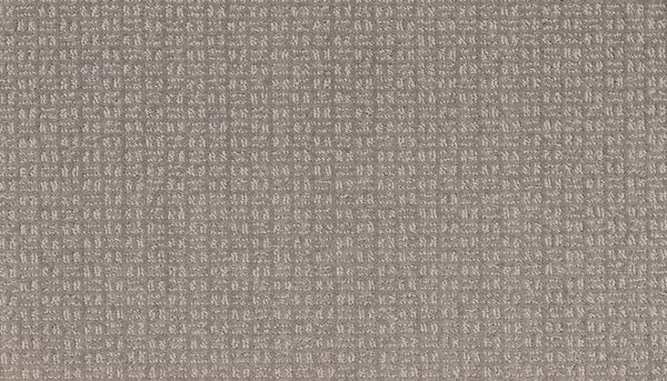 A close-up of Radiant Space On Trend Carpet in Rough Stone, showcasing a cushioned surface with a soft taupe hue and a subtle grid pattern of small, evenly spaced lines for modern appeal.