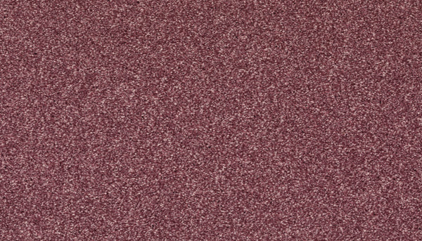 A close-up of reddish-brown sandpaper displays its rough texture—ideal for prepping surfaces before installing Radiant Surface Pet Friendly Carpet in Sangria.