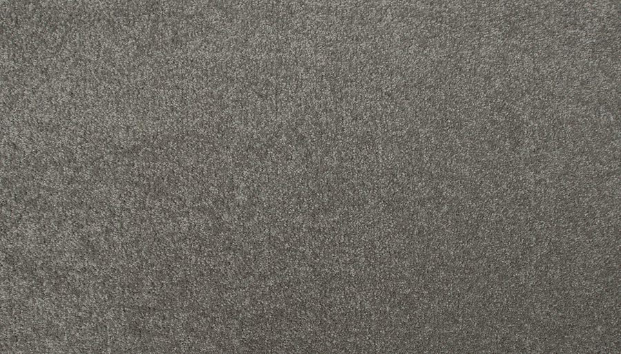 Close-up of the Radiant Surface Pet Friendly Carpet in Rough Stone—a grey, textured luxury carpet with a soft, dense surface and subtle shine. Uniform fiber distribution offers stylish comfort, ideal for homes with pets.
