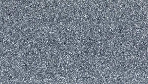 Close-up of Radiant Tone Pet Friendly Carpet in Day Dream color, featuring a textured gray surface with a speckled pattern of light and dark gray particles that create a luxurious look.