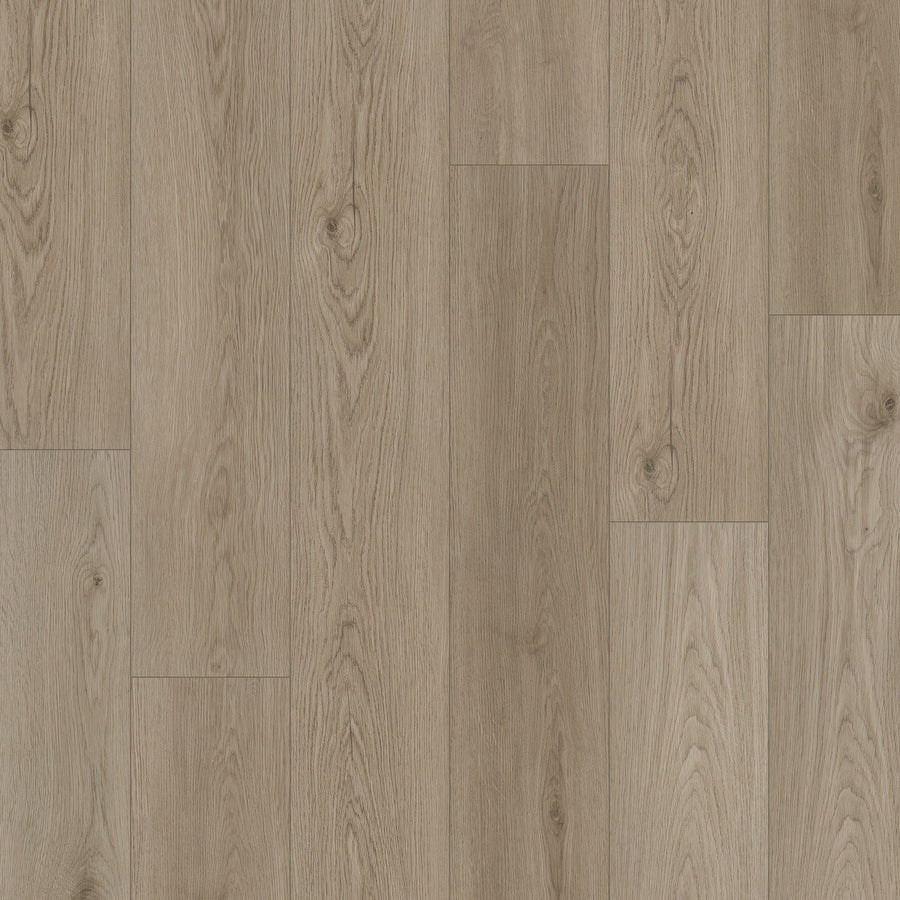 Coretec Pro Plus Enhanced Vinyl features light brown wood flooring with visible grain and knots in a staggered plank layout, offering a natural oak look, textured finish, and the durability of rigid core waterproof construction.
