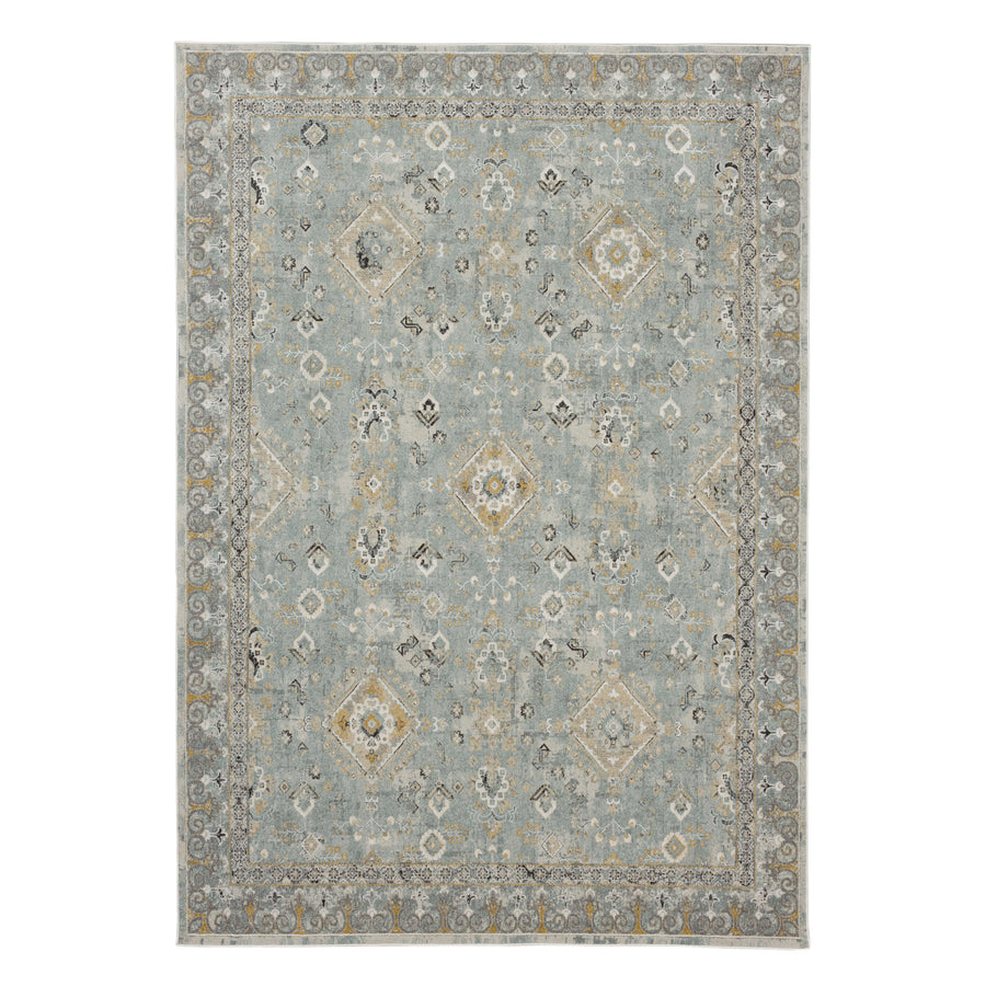 The Windermere Ravenglass Blue Area Rug features a soft blue background with elegant floral and geometric patterns in gray, cream, and gold, accented by an ornate border for a touch of luxury.